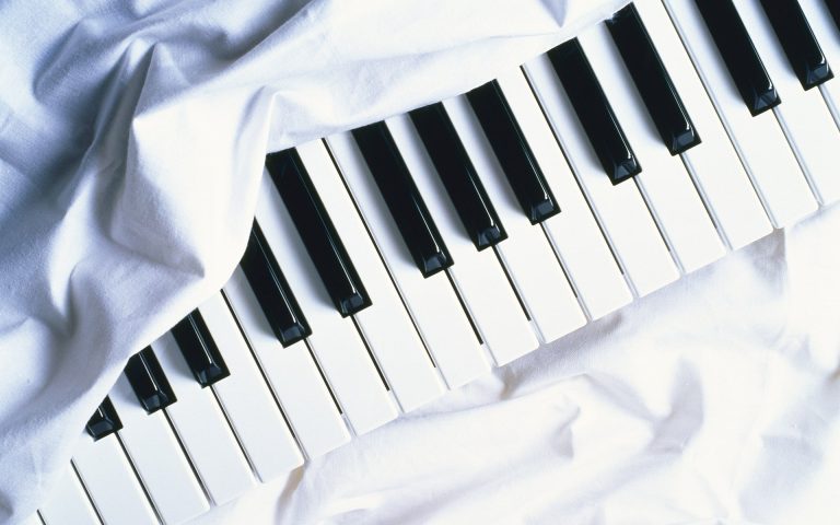 piano wrapped up in white sheets 768x480